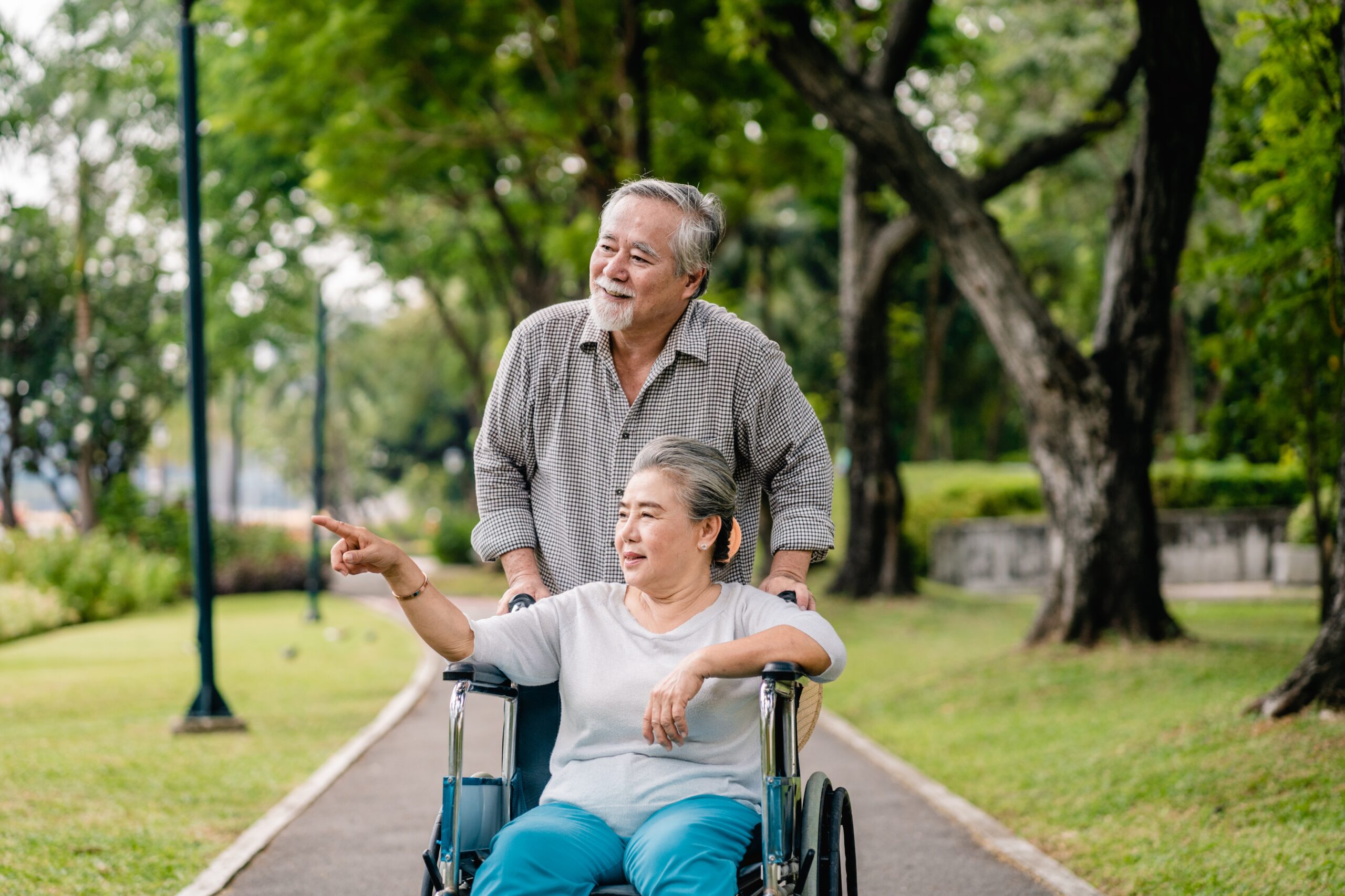 Asian,Senior,Man,With,Wife,In,Wheelchair,Walking,Relaxing,Happy Asian,Senior,Man,With,Wife,In,Wheelchair,Walking,Relaxing,Happy