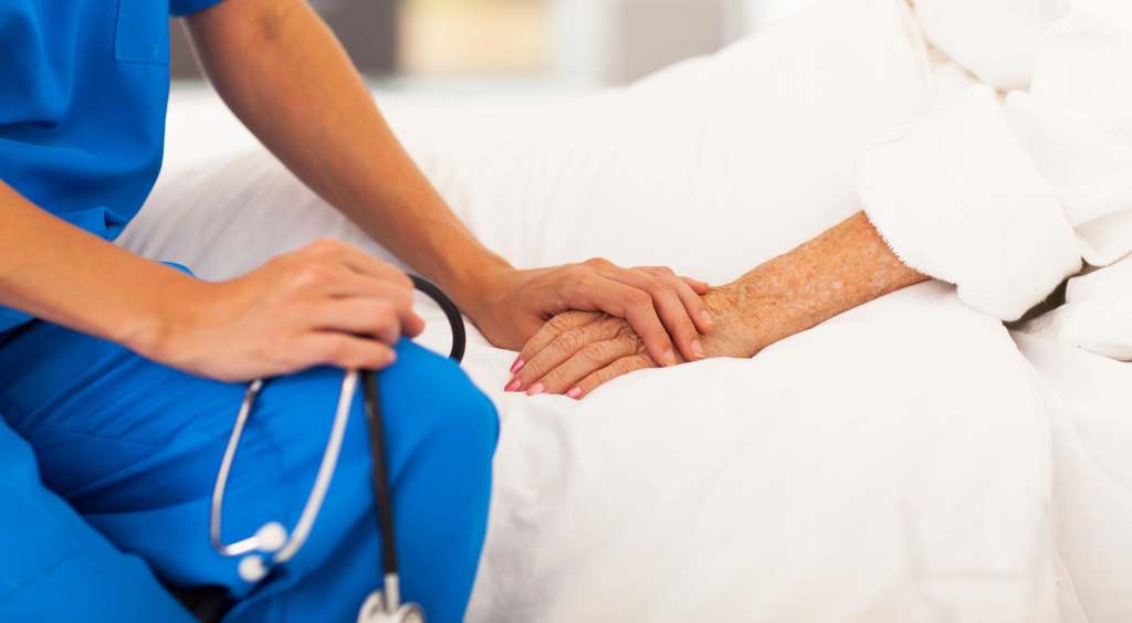 Doctor holding a patientes hand Doctor holding a ptients hand