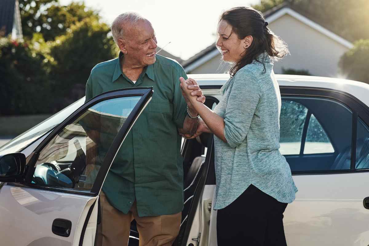 Older adult arriving at home Older adult arriving at home in car